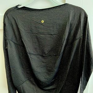 Lululemon Back in Action long sleeve -black with gold stripes. Size 6.